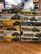 Twelve model kits of Tanks by Tamiya and Italeri