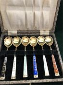 A boxed set of silver and enamel coffee spoons, made in Norway.