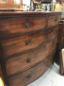 A Large bow front Chest of Drawers