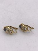 A pair of 18ct yellow gold sapphire and diamond earrings