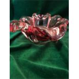 A Cranberry glass, encased bowl.