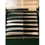 A boxed set of silver handled butter knives, one AF.