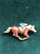 A Horse racing brooch