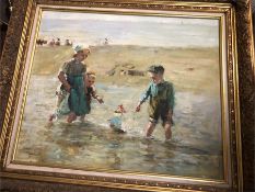 An oil on canvas of Children playing on the beach