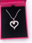 An 18 ct white gold heart shaped pendant necklace on chain