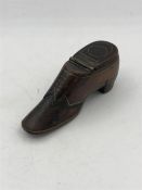 A snuff box in the shape of a shoe.