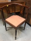 An Edwardian corner chair with onlay