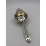 A Birmingham silver hallmarked tea strainer.