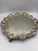 An Edinburgh Hallmarked three footed silver tray, 745g.