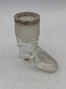 A glass boot match striker with silver rim