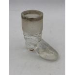 A glass boot match striker with silver rim