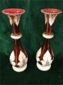 A Pair of red Bohemian glass vases and a third to match