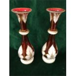 A Pair of red Bohemian glass vases and a third to match