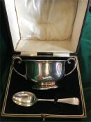 A cased silver Christening set, makers mark BBS ltd, Birmingham 1927, porridger and spoon.