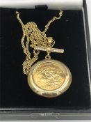 A 2003 half sovereign pendant on a 9ct gold chain.