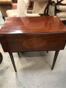 An hall table with one drop leaf and decorative fruit wood inlay