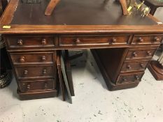 A pedestal desk with leather top