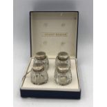 Boxed set of four silver and crystal salt and peppers