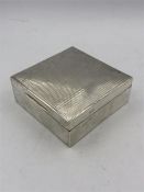 A silver cigarette box by Charles Perry & Co, hallmarked Chester.