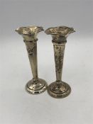 A pair of silver vases, hallmarked Sheffield by James Deakin and Sons