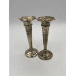 A pair of silver vases, hallmarked Sheffield by James Deakin and Sons