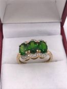 A 14ct Yellow Gold green garnet and diamond ring