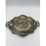 An ornate silver tray, marked 800