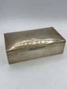 A silver cigarette box by Albert Sydenham, hallmarked Birmingham 1926.