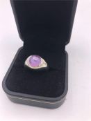 A 14ct white gold cats eye pink sapphire and diamond ring