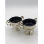 Two Sheffield hallmarked 1900 cruets with blue glass liners by James Deakin and Sons