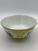 A 20th Century Chinese tea bowl with yellow grounds