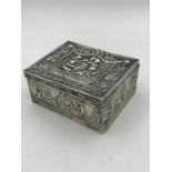 An ornate silver box, hallmarked and makers mark BM.