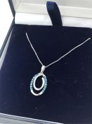 A fine 10ct white gold blue and white diamond pendant necklace