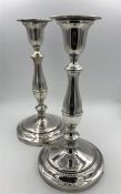 A pair of silver candlesticks, hallmarked London 1966.