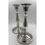 A pair of silver candlesticks, hallmarked London 1966.