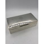 A silver cigarette box by Page Keen & Page, hallmarked London 1941.