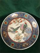 A 19th Century Chinese plate with hand painted design including birds.