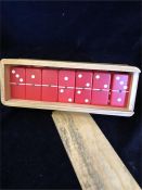 A box of red melamine Japanese dominoes