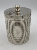 A small caddy, silver plated, ribbed with lid.