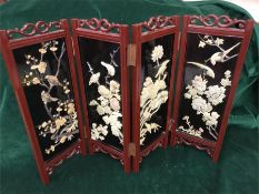 A miniature lacquered Chinese screen