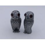 A Pair of 800 Continental silver owl condiments with glass eyes.