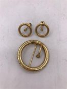 A Brooch and earring set marked 14ct gold.