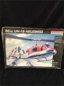 A Monogram model kit for a Bell UH-1B Heliswiss Helicopter