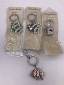 Three fish and a dice handbag/keyring charms