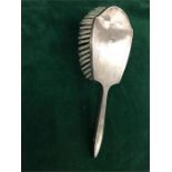 A Hallmarked silver backed dressing table brush