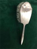 A Hallmarked silver backed dressing table brush