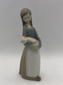 Lladro figure of a lady carrying a pig.