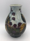 A Moorcroft vase, blackberry pattern 19cm