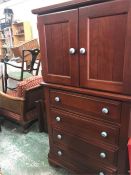 A Tall Boy or linen press style cabinet with blue ceramic handles