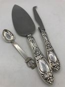 A Norwegian hallmarked silver handled cake slice, cheese knife and teaspoon.